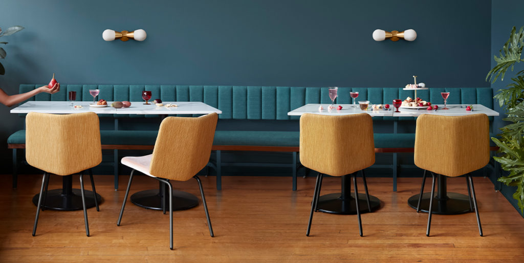 Yellow upholstered Alfred chairs in restaurant.