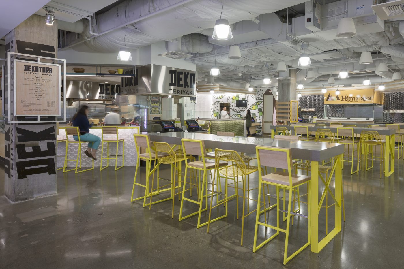 Brady barstools with yellow frame in corporate cafe.