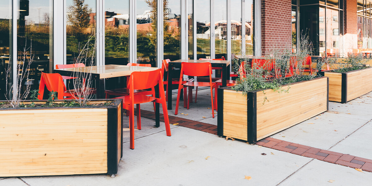 Restaurant patio with red Sadie II Chairs.