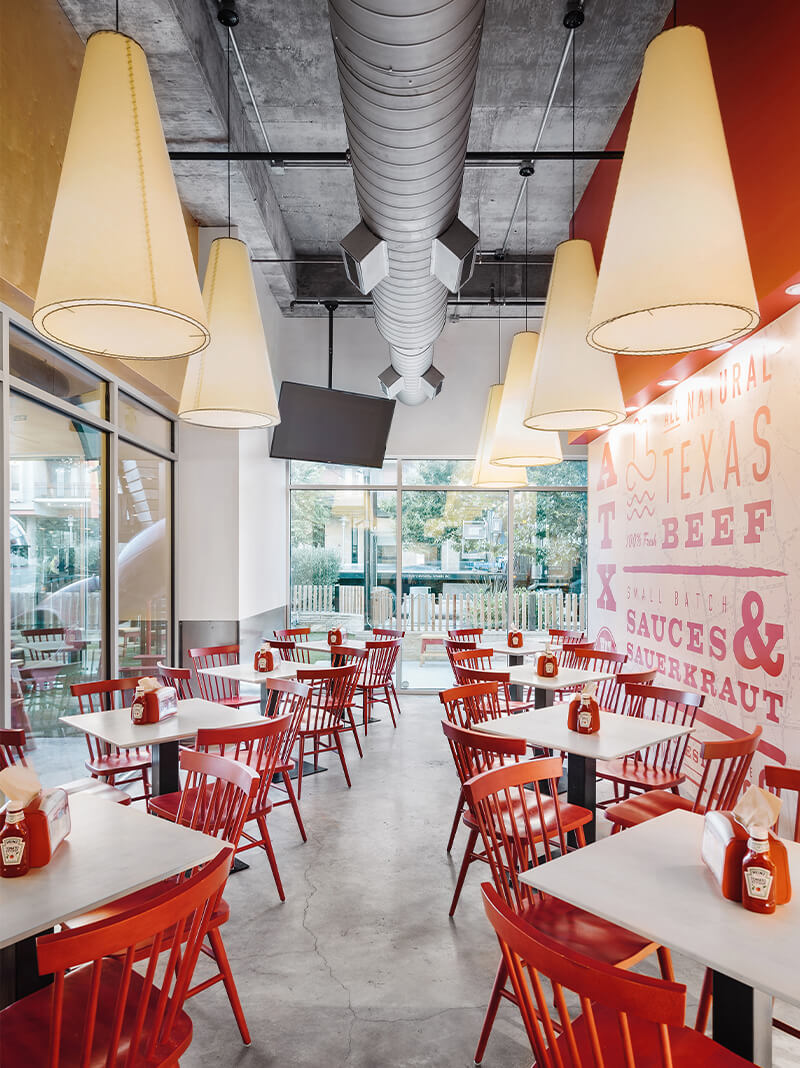 Restaurant with red Hugh chairs.