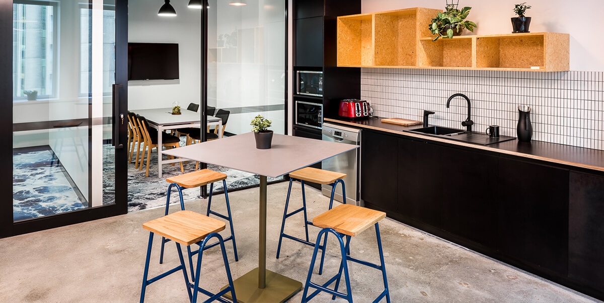 Half Hurdle Barstools in corporate kitchen.