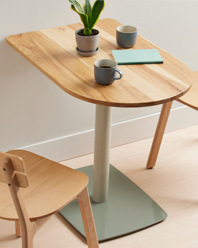 D Shaped Onesima Table with coffee cups.