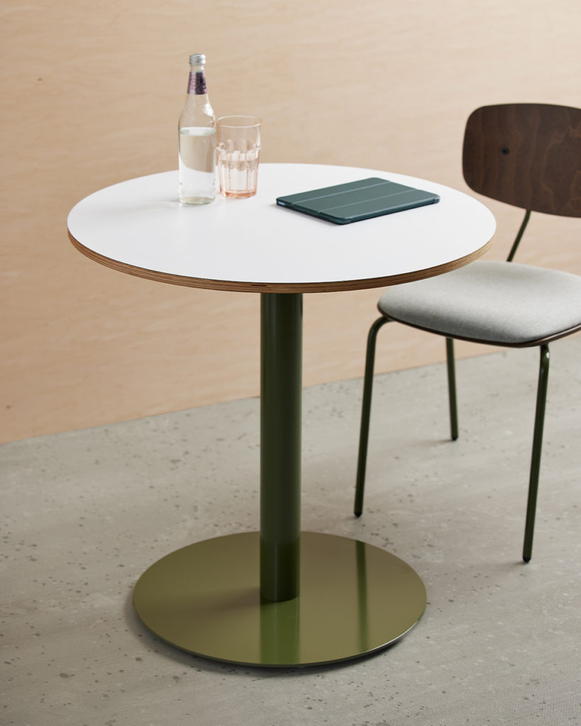 Round Onesima Pedestal Table with green base.