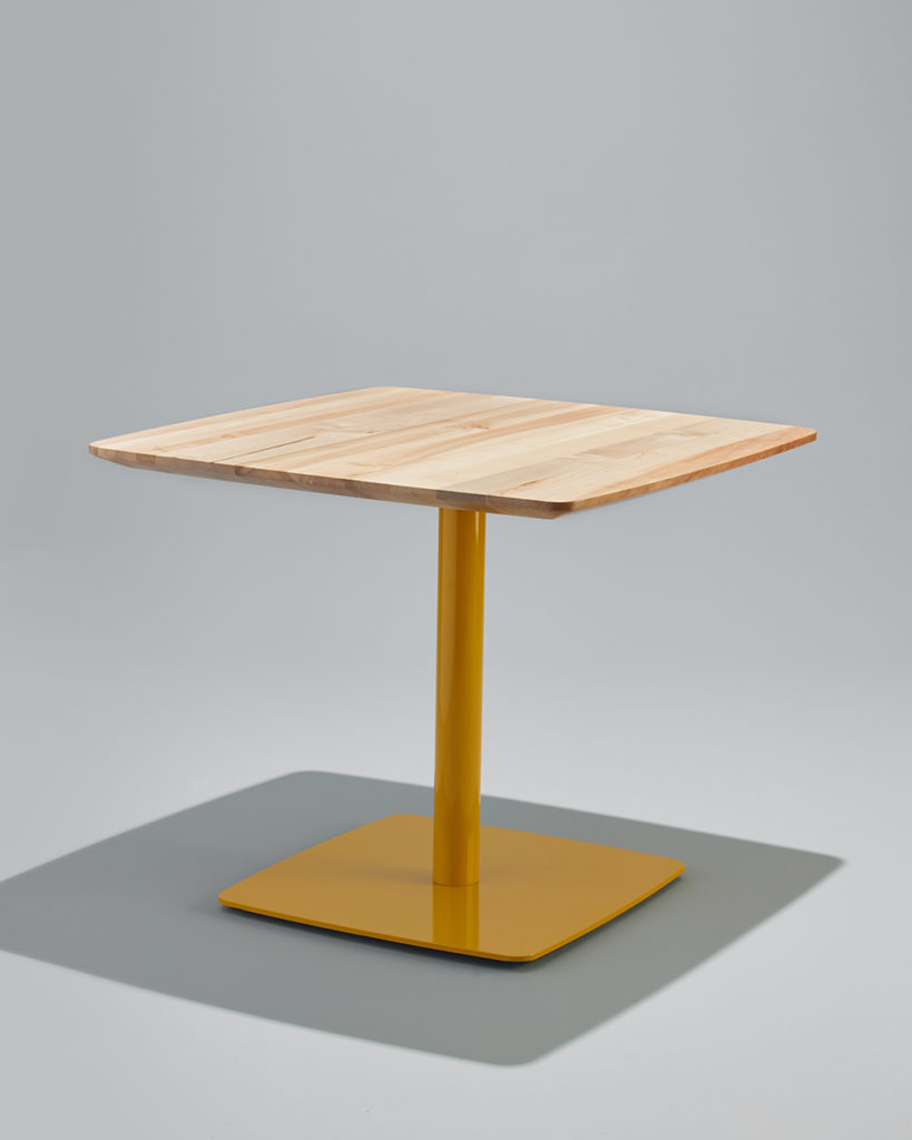 Dining Height Onesima Pedestal Table with yellow base.