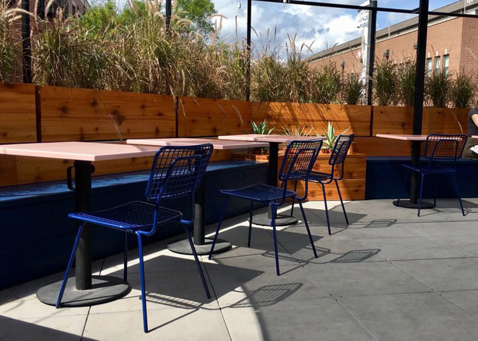 Opla Chairs in outdoor restaurant patio.
