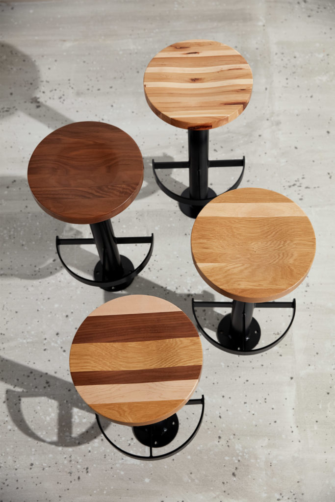 Aerial view of Sally Bolt Down Stools with wood seats.