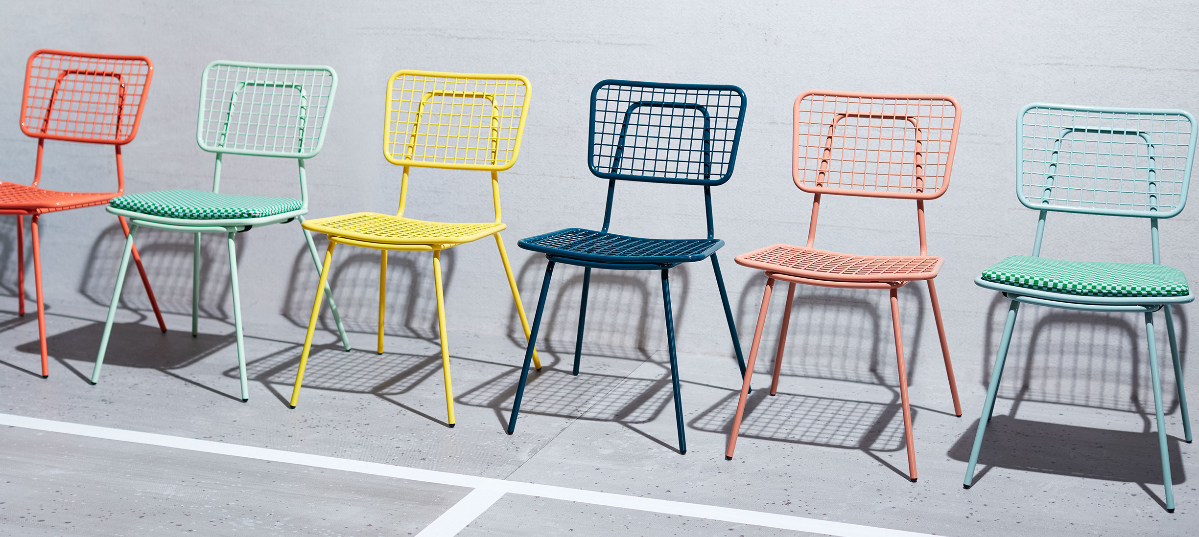 Row of multi colored Opla Chairs.
