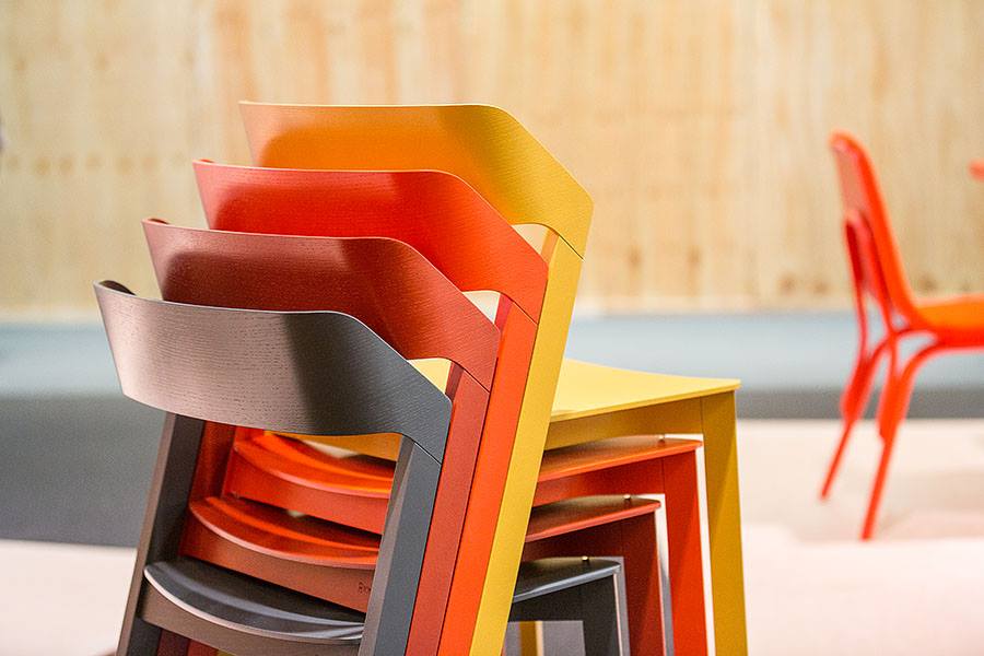 Stack of multi colored Merano chairs.