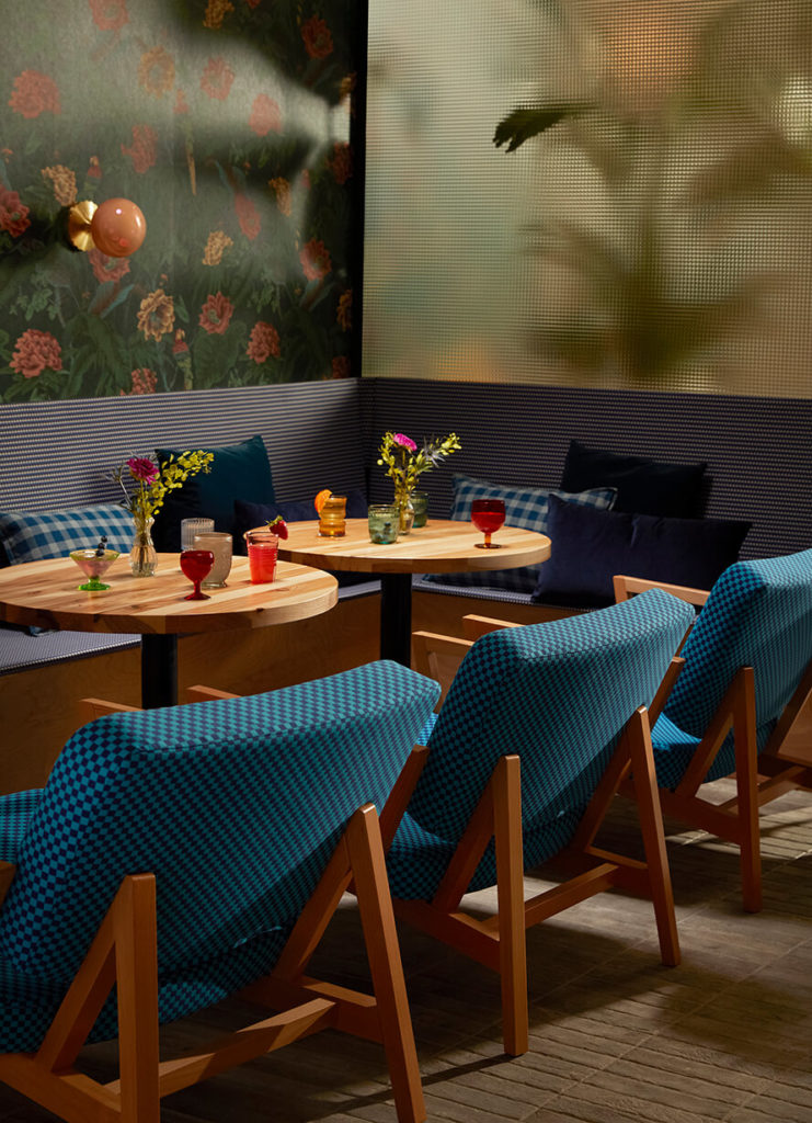 Andy Lounge Chairs with Orbit Pedestal Tables in restaurant.