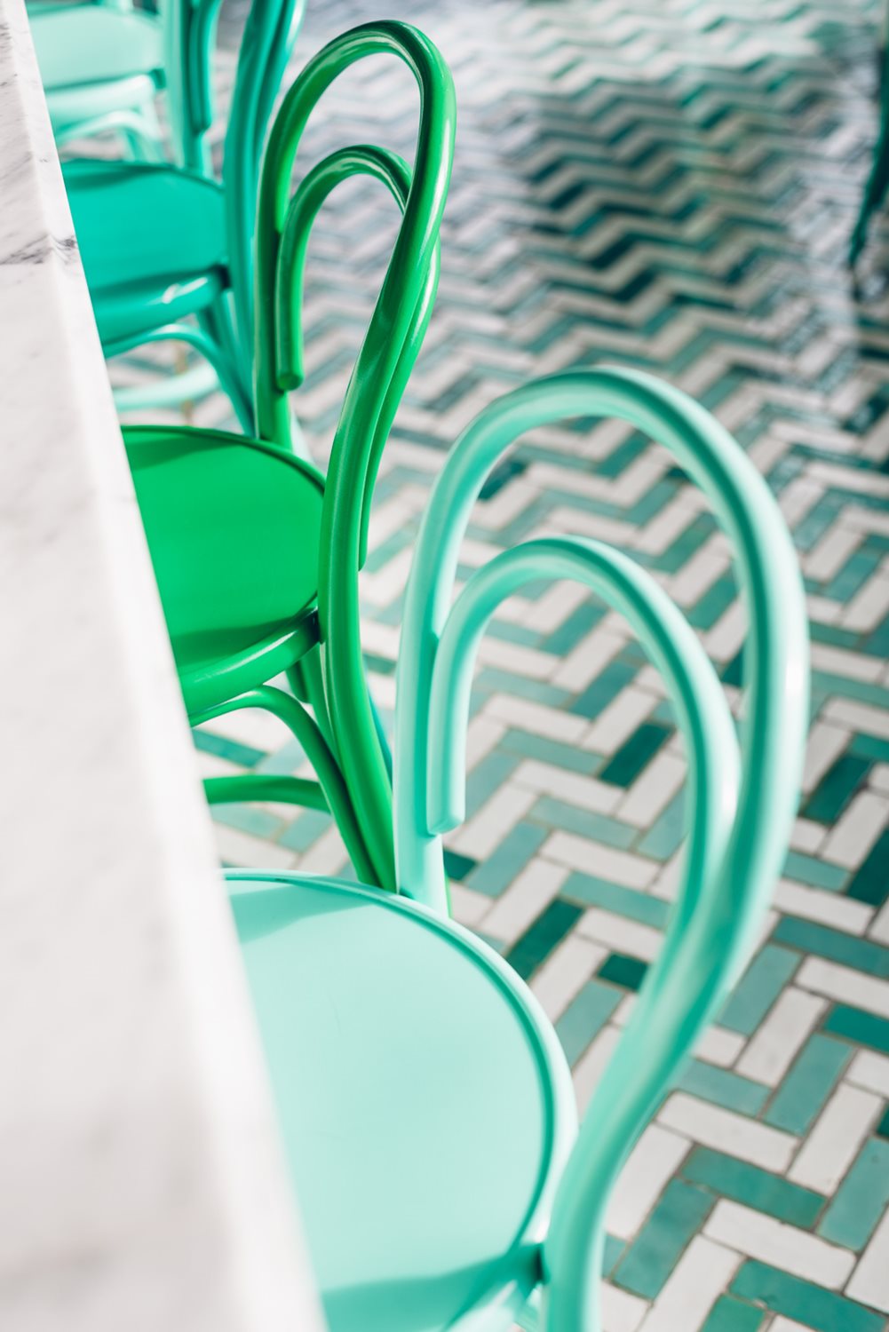 Aerial view of green and blue Bentwood Stools.