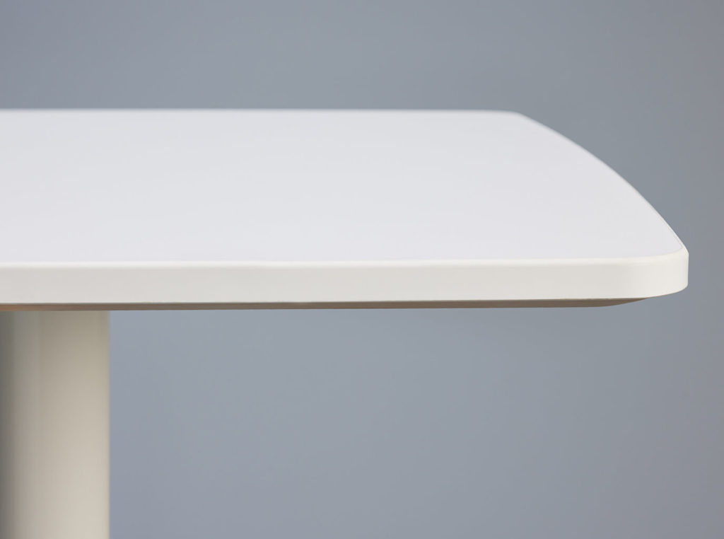 Onesima table edge with white laminate.