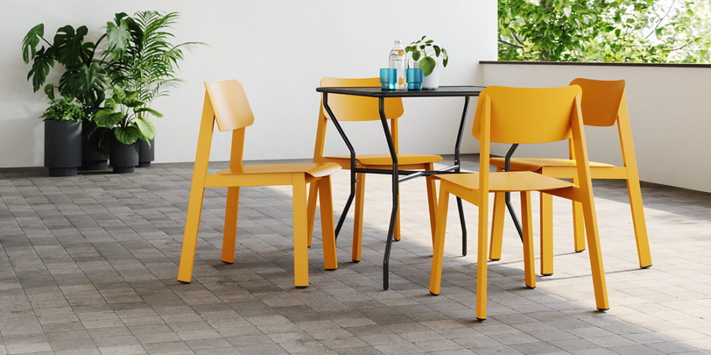 Opla Outdoor Table with set of yellow Sadie II Chairs.