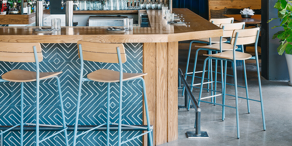 Restaurant bar with set of Sherman Stools.