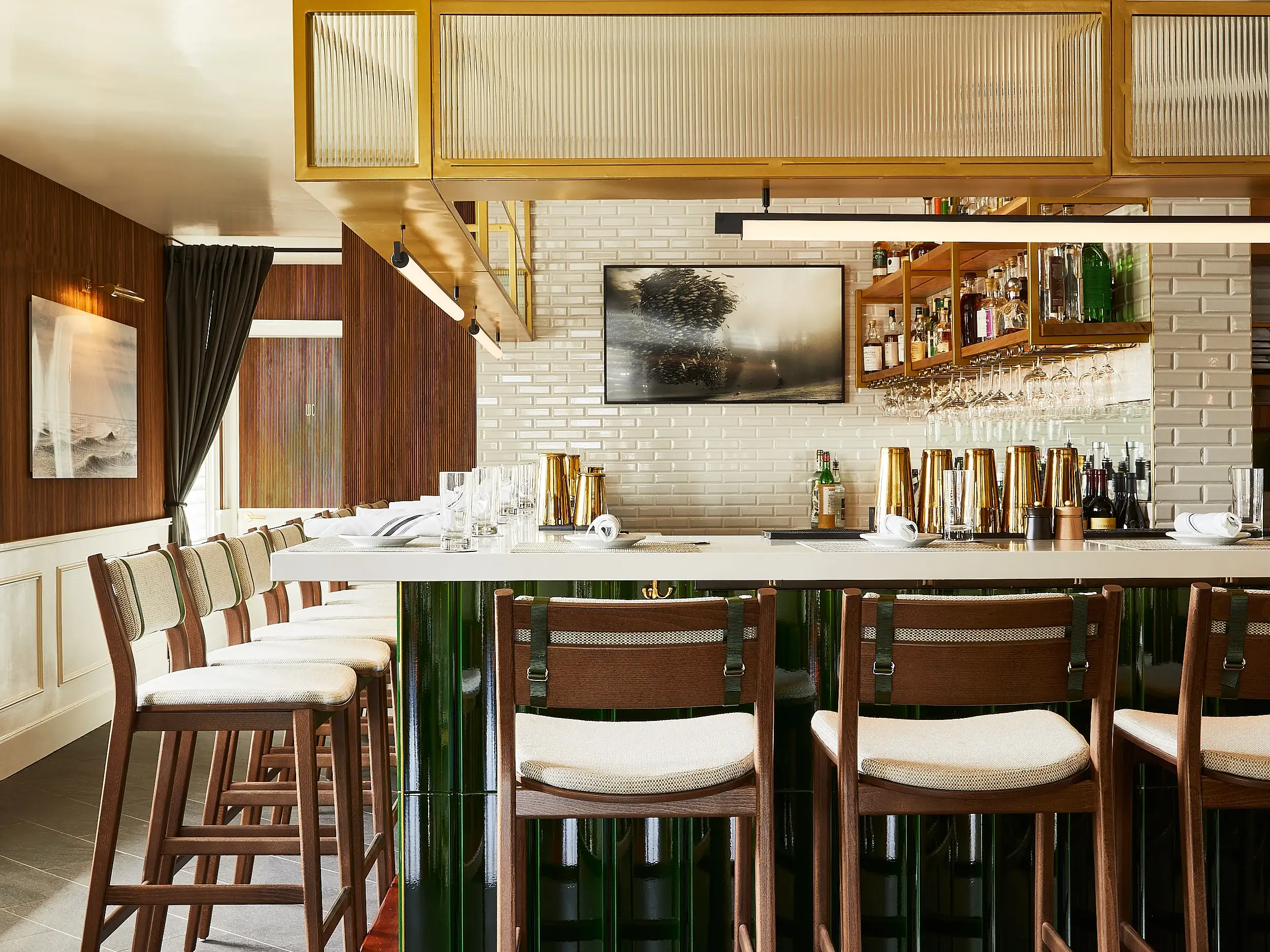 Restaurant bar furnished with upholstered Sigsbee Barstools.