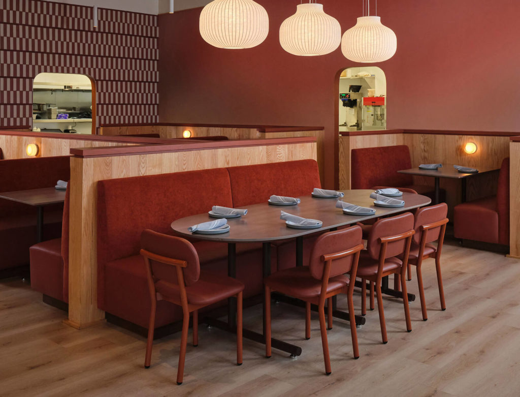 Ferdinand Chairs in maroon around restaurant table.