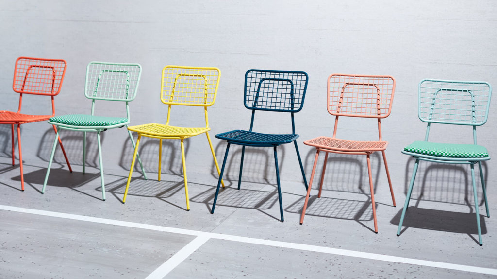 Row of multi colored Hula chairs.