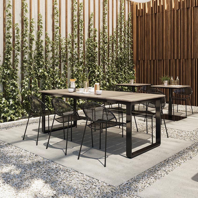 Bowen Communal and Pedestal Tables paired with Hula seating in a biophilic inspired patio