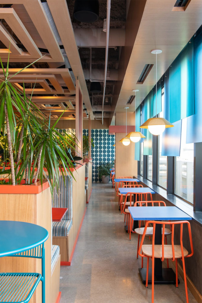 Colorful restaurant inspired break room featuring Leo Chairs