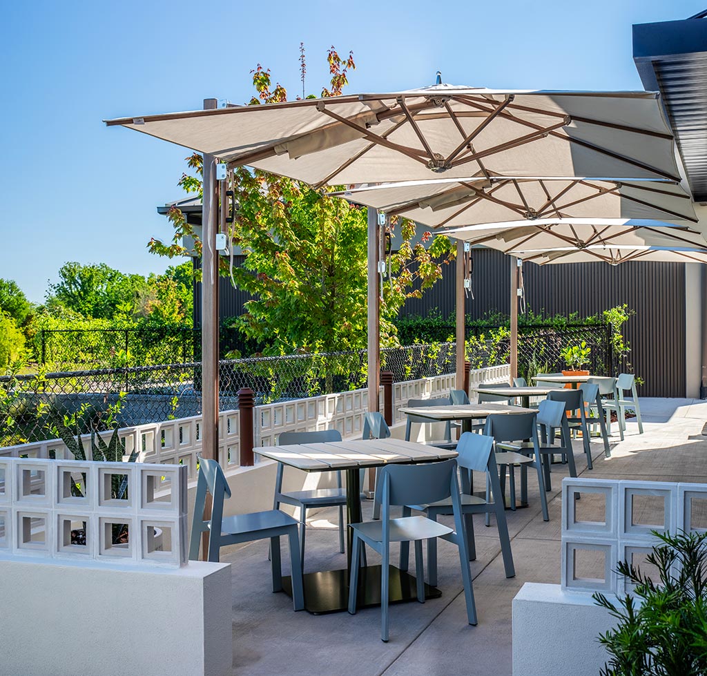Restaurant outdoor patio featuring Sadie II outdoor chairs and Bowen pedestal tables