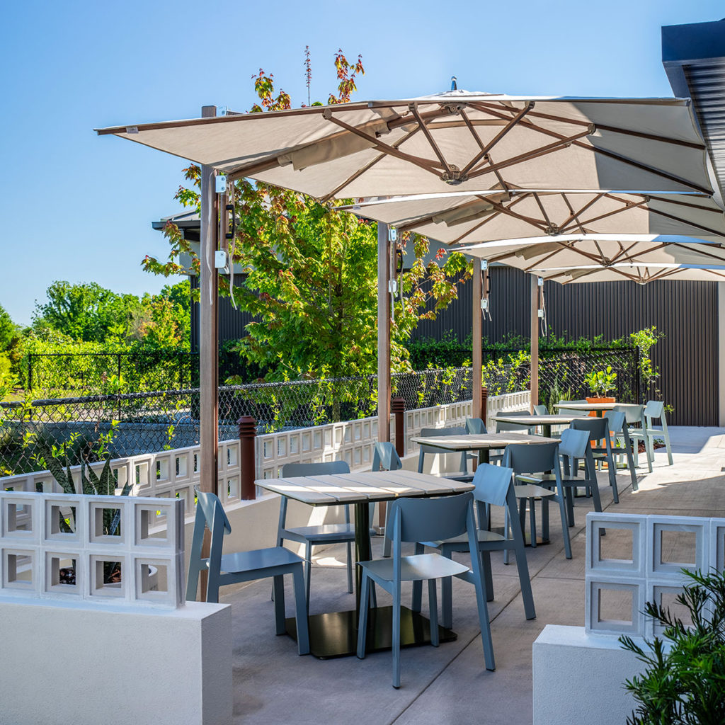 Restaurant outdoor patio featuring Sadie II outdoor chairs and Bowen pedestal tables