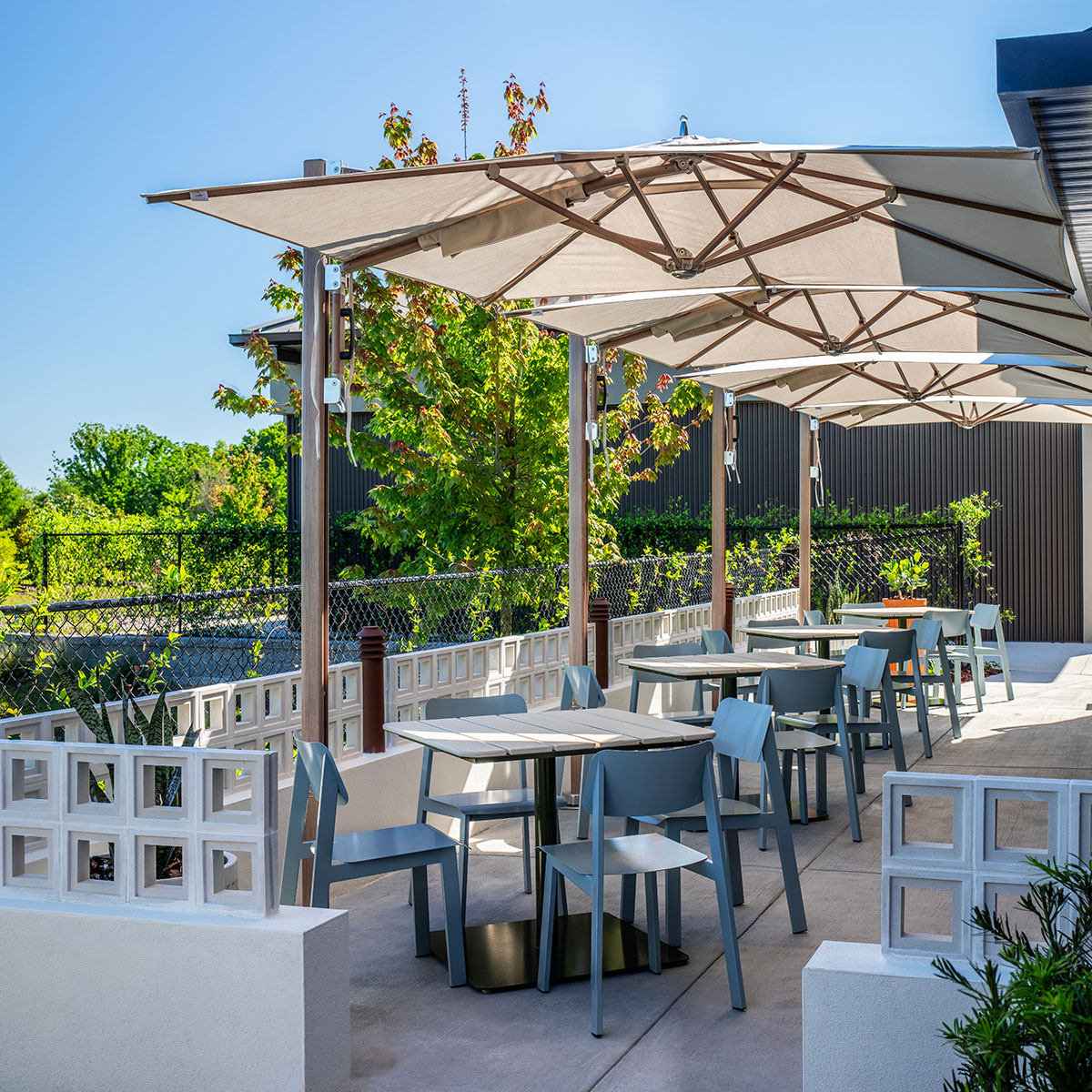 Restaurant outdoor patio featuring Sadie II outdoor chairs and Bowen pedestal tables