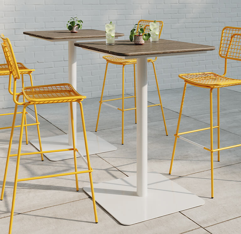 Pair of Bowen Pedestal Tables with yellow Opla Stools.