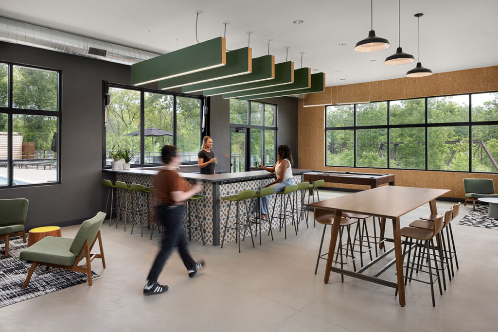 A social hub in a community clubhouse featuring a variety of seating options for mixed use