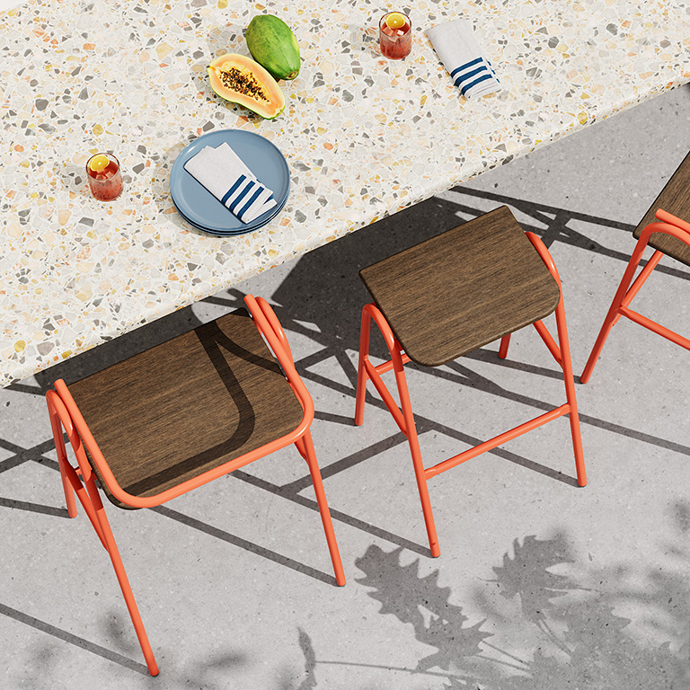 Overhead view of Hurdle and Half Hurdle Outdoor Stools with a Walnut colored HDPE seat and a Salmon Orange frame