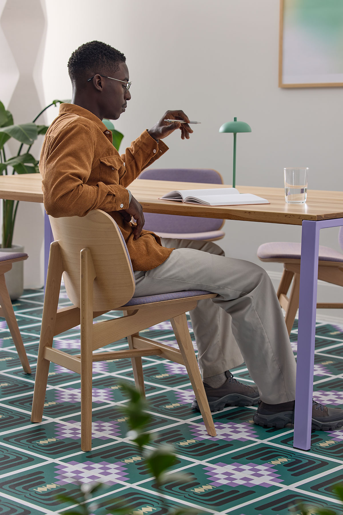 social-hub-communal-table-person-working-purple-bennet-chair