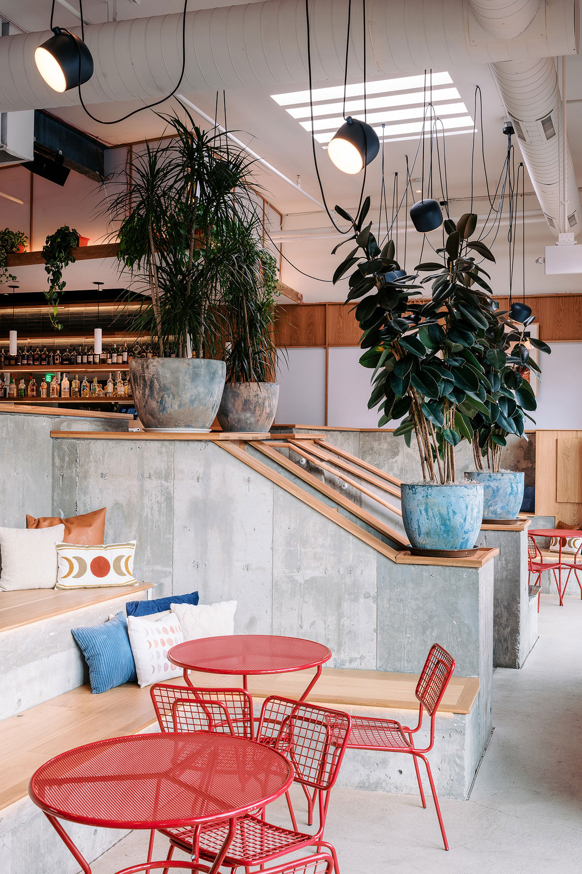 two-moons-music-hall-conversation-pit-opla-chair-table-red-daylight-portrait